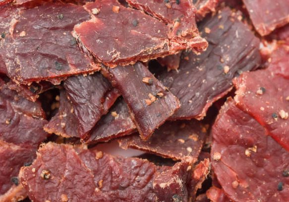 Peppered Beef Jerky close up full frame background